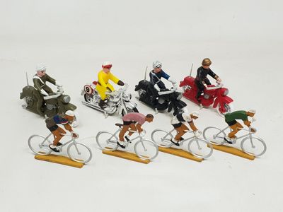 many figurines of people riding bikes on a white surface