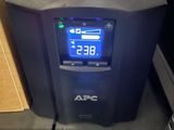 a picture of a ups unit with a clock on the front