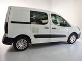 a white van that is parked in a white room