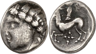 a close up of a coin with a horse on it
