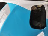 a close up of a blue and white train on the tracks