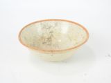 a white bowl with a brown rim sitting on a white surface