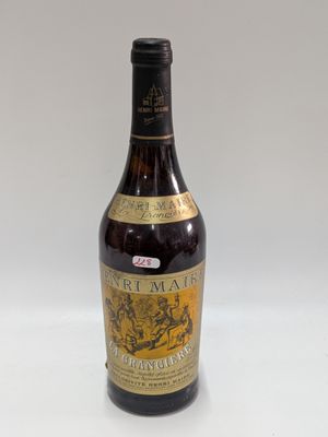 an image of a bottle of wine sitting on top of a table