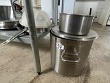stainless steel pots and pans sit on top of a stainless steel stove