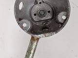 a close up of a metal object on a white surface