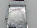 red and white strap on a watch with a tag on it