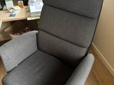 a chair that is sitting in front of a computer desk