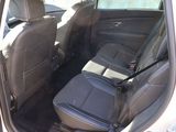 the back seat of a car with a seat belt in it