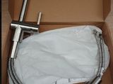 a box with a faucet and a bag in it