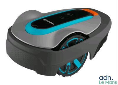 a robotic lawn mower with a blue and orange trim