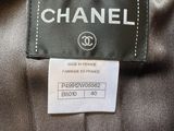 a label on a black jacket that says chanel