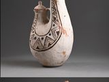 several different types of vases with designs on them on a gray background