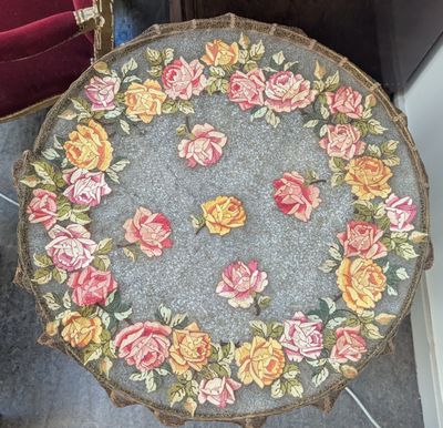 a small table with a flowered design on it