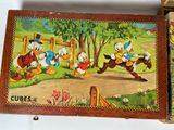 a wooden box with a picture of donald duck and other cartoon characters on it