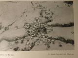 an old picture of a small town in the middle of the picture
