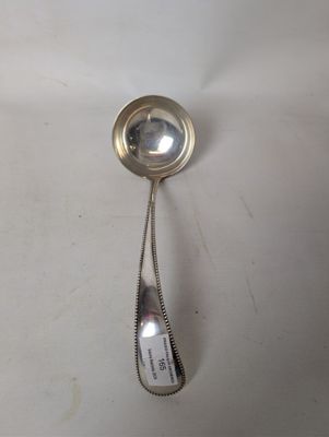a silver spoon with a spoon handle on it