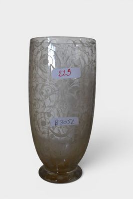 a glass vase that has a label on it