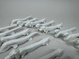 a lot of white dog figurines sitting on a table