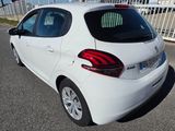 a white car that is parked on the side of the road