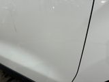 a white car with a black stripe on the side of it