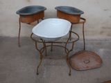 two bowls sitting on top of a stand next to each other
