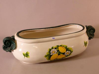 an image of a ceramic planter with flowers on it