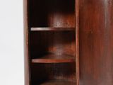 an image of a wooden cabinet with a door open