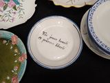 many plates that are sitting on a black table