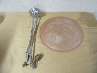 a bowl and a spoon on a table next to a glass