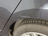 a close up of a car ' s tire on the road