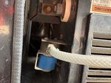 a close up of a machine with a hose attached to it