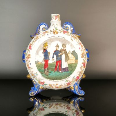 a picture of a decorative plate with a picture of a man and a woman on it