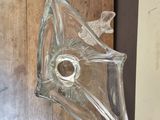 a glass object that is hanging on the wall