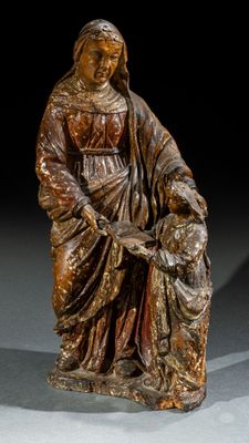 statue représentant une femme tenant un enfant sur ses genoux
