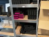 many boxes and bins on the shelves in the store