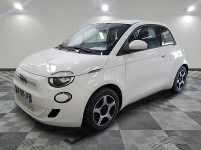 an image of a white smart car in a showroom
