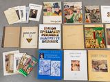 many books on the floor with pictures on them