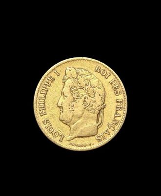 a close up of a gold coin on a black background