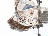 a silver tray with a mirror on it on a white surface