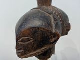 a statue of a fish on a glass stand