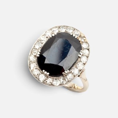 an image of a black and white diamond ring on a white background