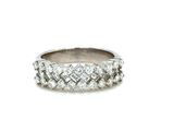 a close up of a diamond ring on a white background
