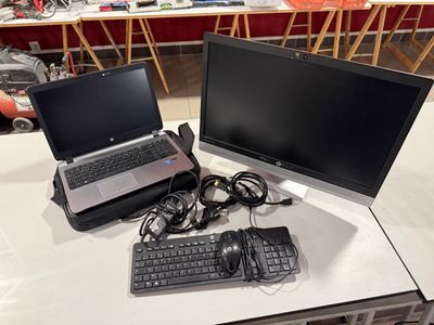 two laptops and a keyboard on a table
