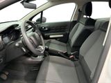 the interior of a small car with a steering wheel and dashboard
