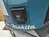 a close up of a blue and white helmet on a table