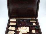 an old wooden box with a lot of items inside of it