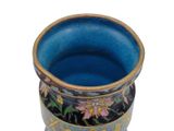 a blue vase with a floral design on it