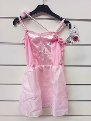 a pink dress hanging on a wall with a crown on it