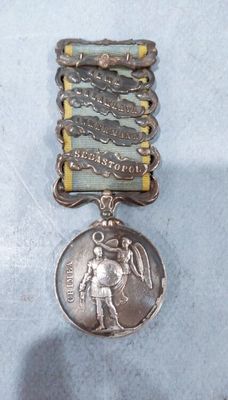 silver medal on a blue background with a silver medal in the middle of it
