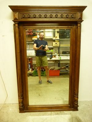 a man taking a picture of himself in a mirror